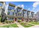 Modern townhome exterior with large windows, stylish trim, and well-maintained landscaping on a sunny day at 1617 Cannon View Ln, Charlotte, NC 28208