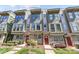 Modern townhome exterior with large windows, stylish trim, and well-maintained landscaping on a sunny day at 1617 Cannon View Ln, Charlotte, NC 28208