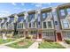 Modern townhome exterior with large windows, stylish trim, and well-maintained landscaping on a sunny day at 1617 Cannon View Ln, Charlotte, NC 28208