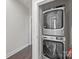 This laundry room features a stacked washer and dryer, offering convenience and efficiency at 1617 Cannon View Ln, Charlotte, NC 28208