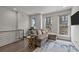 View of the living area and stairs including a gray sofa with patterned throw pillows, and a side table at 1617 Cannon View Ln, Charlotte, NC 28208