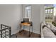 Functional workspace featuring a desk and a view of the window, located near the living area with gray sofa at 1617 Cannon View Ln, Charlotte, NC 28208