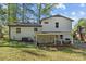 Rear exterior of home showcasing the large backyard with plenty of shade at 1801 Weststone Dr, Charlotte, NC 28208