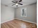 Bedroom with hardwood floors, a ceiling fan and window offering lots of light at 1801 Weststone Dr, Charlotte, NC 28208