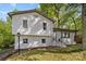 Charming exterior view of a white home with well-maintained landscaping at 1801 Weststone Dr, Charlotte, NC 28208