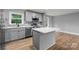 Modern kitchen with stainless steel appliances, stone countertops and island at 1801 Weststone Dr, Charlotte, NC 28208