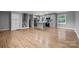 Open concept living area featuring hardwood floors and a staircase to the second floor at 1801 Weststone Dr, Charlotte, NC 28208