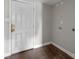 Mud Room showing white door and hook ups for washer and dryer at 1801 Weststone Dr, Charlotte, NC 28208