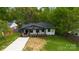 Aerial view of the front of the house featuring a long driveway and well manicured lawn at 1812 Lot 2 Anderson St, Charlotte, NC 28205