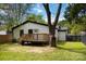 Backyard featuring a deck with wooden railings, lawn, and a newly painted home at 1812 Lot 2 Anderson St, Charlotte, NC 28205