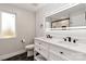 Contemporary bathroom with dual sink vanity, black fixtures, lighted mirror and white shiplap walls at 1812 Lot 2 Anderson St, Charlotte, NC 28205