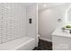Bright bathroom features black hexagon floor tiles and white subway tile in the shower at 1812 Lot 2 Anderson St, Charlotte, NC 28205