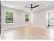 Spacious, naturally lit bedroom features neutral paint, light wood floors, and a dark ceiling fan at 1812 Lot 2 Anderson St, Charlotte, NC 28205