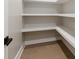 Walk-in closet boasts built-in shelves for seamless and accessible storage at 1812 Lot 2 Anderson St, Charlotte, NC 28205