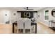Elegant dining room features a modern table, stylish chairs, and a view into a comfortable living area at 1812 Lot 2 Anderson St, Charlotte, NC 28205