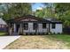 Charming bungalow with a covered porch, black trim, and freshly painted white brick at 1812 Lot 2 Anderson St, Charlotte, NC 28205