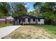 Charming bungalow with a covered porch, black trim, and freshly painted white brick at 1812 Lot 2 Anderson St, Charlotte, NC 28205