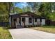 Charming bungalow with a covered porch, black trim, and freshly painted white brick at 1812 Lot 2 Anderson St, Charlotte, NC 28205