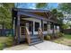 Charming bungalow with a covered porch, black trim, and freshly painted white brick at 1812 Lot 2 Anderson St, Charlotte, NC 28205