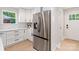 Kitchen featuring a stainless steel refrigerator and white cabinets at 1812 Lot 2 Anderson St, Charlotte, NC 28205