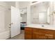 Bright bathroom with a vanity, mirror, and bathtub/shower combination for convenience at 1821 Ethel Guest Ln, Charlotte, NC 28206