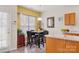 Sunny dining area with a contemporary table set, complemented by a window that brings in natural light at 1821 Ethel Guest Ln, Charlotte, NC 28206