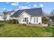 Exterior view of a house with a well-maintained backyard and patio at 2020 Makin Dr, Indian Trail, NC 28079