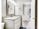 Bright bathroom featuring a granite vanity and a decorative mirror at 2020 Makin Dr, Indian Trail, NC 28079