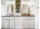 Bright bathroom featuring a double vanity and built-in storage at 2020 Makin Dr, Indian Trail, NC 28079