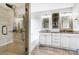 Bright bathroom featuring a double vanity and glass door shower at 2020 Makin Dr, Indian Trail, NC 28079