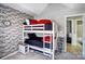 Bedroom with a set of bunk beds and decorative brick accent wall at 2020 Makin Dr, Indian Trail, NC 28079