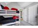 Cozy bedroom with a bunk bed and adjoining bathroom at 2020 Makin Dr, Indian Trail, NC 28079