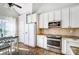 This kitchen features white cabinets, granite countertops and stainless steel appliances at 2020 Makin Dr, Indian Trail, NC 28079