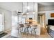 Open floor plan with kitchen island featuring bar stool seating and pendant lighting at 2020 Makin Dr, Indian Trail, NC 28079