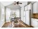 Eat-in kitchen area features a black dining table set, white cabinets and lots of natural light at 2020 Makin Dr, Indian Trail, NC 28079