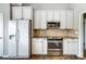 This kitchen offers white cabinets, granite countertops and stainless steel appliances at 2020 Makin Dr, Indian Trail, NC 28079