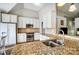 Kitchen boasts granite countertops, stainless steel appliances and white cabinets at 2020 Makin Dr, Indian Trail, NC 28079