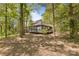 Back of the home features a large deck with sliding glass doors at 21 Hollyberry Woods, Lake Wylie, SC 29710