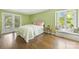 Cozy bedroom offers a plush bed, light-filled windows, and a charming window seat at 21 Hollyberry Woods, Lake Wylie, SC 29710