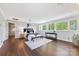 Primary bedroom features hardwood floors, sitting area, and large windows with tree views at 21 Hollyberry Woods, Lake Wylie, SC 29710
