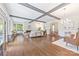 Bright living room featuring a cozy fireplace, hardwood floors, and access to a back deck at 21 Hollyberry Woods, Lake Wylie, SC 29710