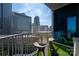 Balcony offers city views, modern seating and artificial turf for a relaxing outdoor experience at 210 N Church St # 1307, Charlotte, NC 28202