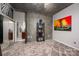 Open-concept bedroom with a large mirror, art and an ensuite bathroom at 210 N Church St # 1307, Charlotte, NC 28202