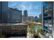 Expansive city view featuring modern skyscrapers, clear skies, with a pool in the distance from a balcony at 210 N Church St # 1307, Charlotte, NC 28202