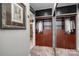 Walk-in closet featuring built-in shelving and mirrored doors at 210 N Church St # 1307, Charlotte, NC 28202