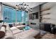 Bright living room featuring a sectional sofa, floor-to-ceiling windows, and a modern chandelier at 210 N Church St # 1307, Charlotte, NC 28202
