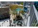 Aerial view of a rooftop area, featuring a cozy outdoor fireplace, a pool and multiple balconies at 210 N Church St # 1307, Charlotte, NC 28202