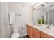 The bathroom is brightly lit, features dual sinks and wood cabinets at 211 Heritage Blvd # 309, Fort Mill, SC 29715