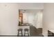 The breakfast bar features luxury vinyl plank flooring, barstools, and an adjacent kitchen and entryway at 211 Heritage Blvd # 309, Fort Mill, SC 29715