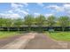 Building exterior with mature shade trees and shrubbery at 211 Heritage Blvd # 309, Fort Mill, SC 29715